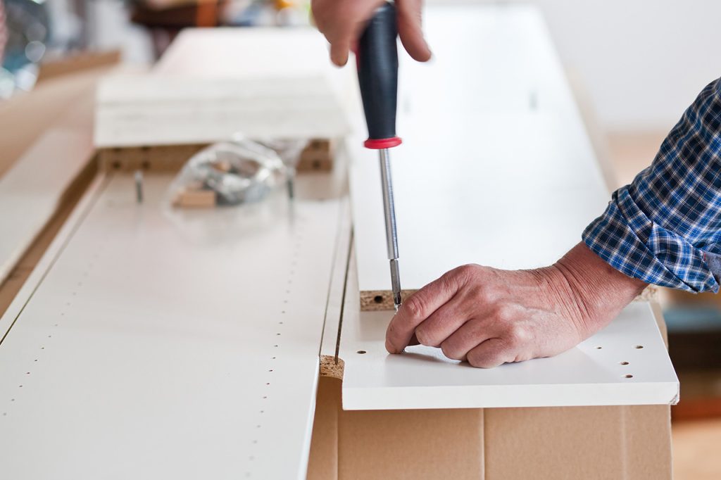 man assembling furniture 1